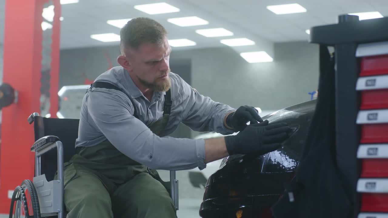 Mechanic In Wheelchair Details Car - Stock Video | Motion Array