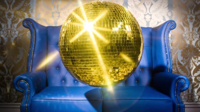 Gold Mirrored Disco Ball And Sofa - Stock Video