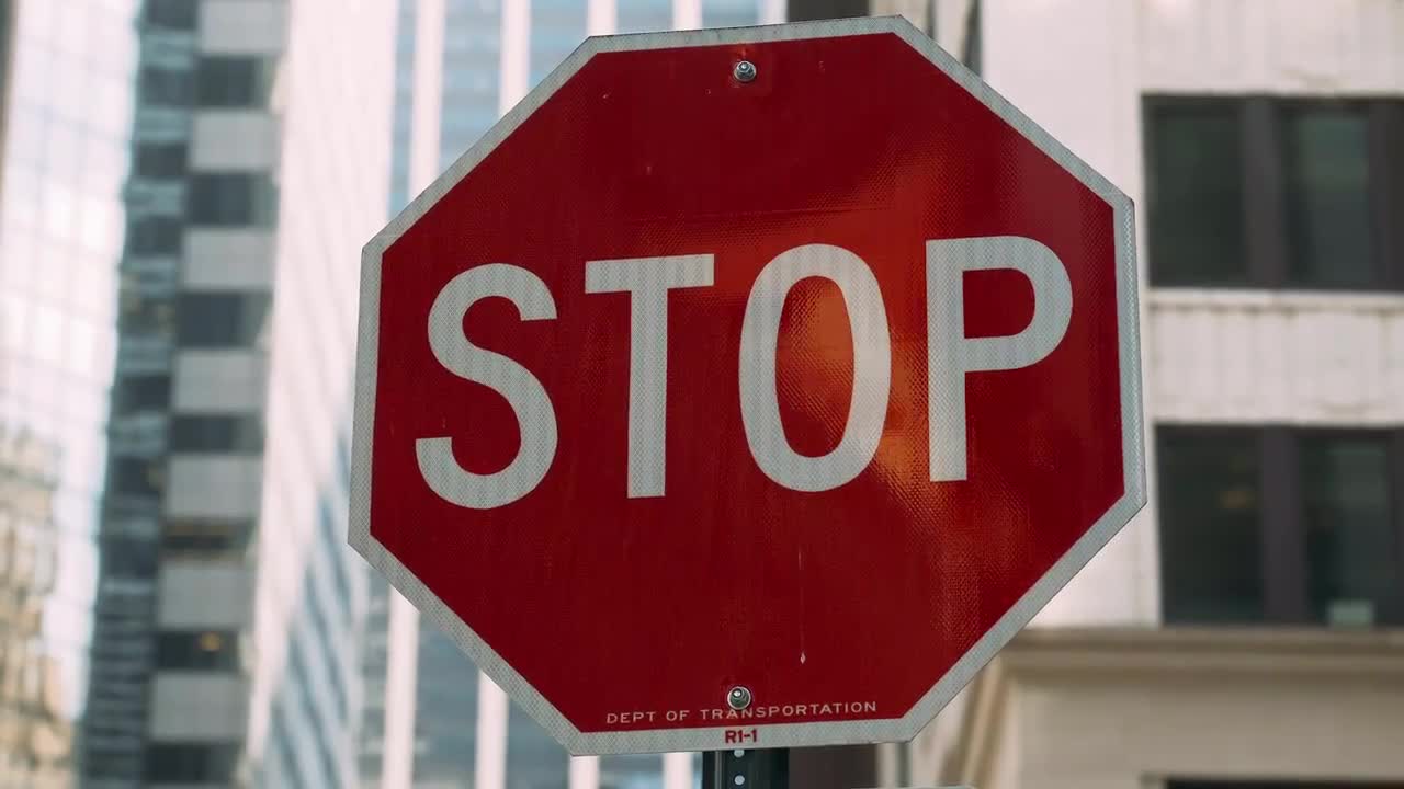 Stop Sign On The Street - Stock Video | Motion Array