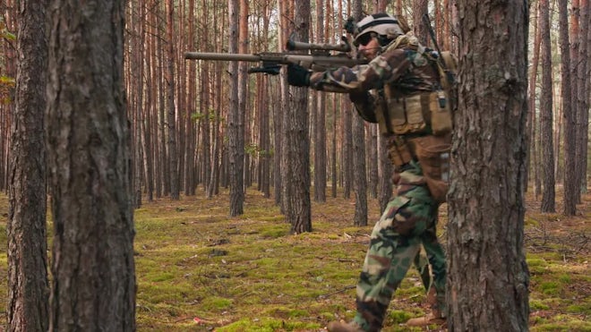 Sniper reload his rifle in forest Stock Photo by ©Nesterenko_Max 89103288