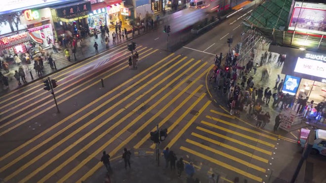 Timelapse of crowds of people crossing roads in Shibuya district