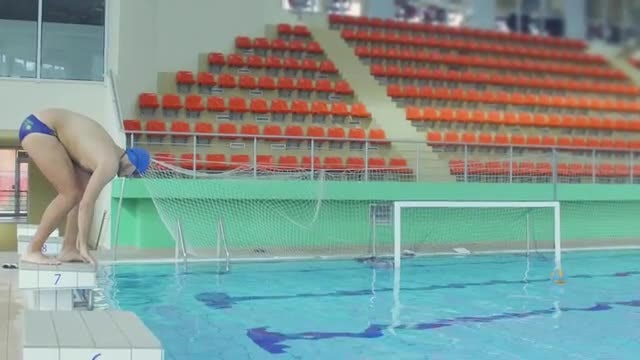 Swimmer Dives Into Pool: Stock Video