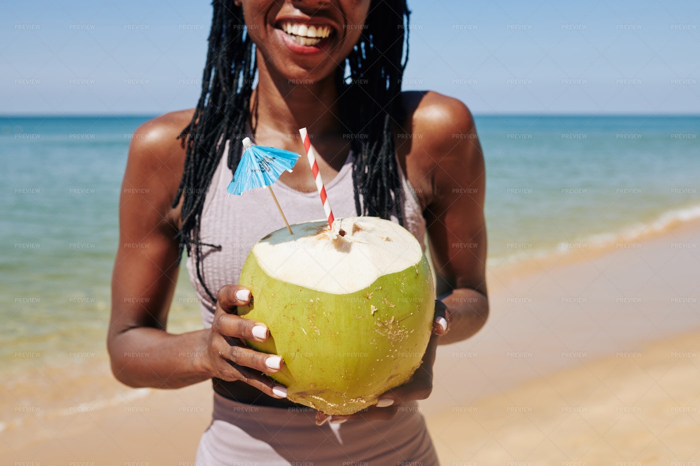 Woman Enjoying Coconut Cocktail: Stock Photos