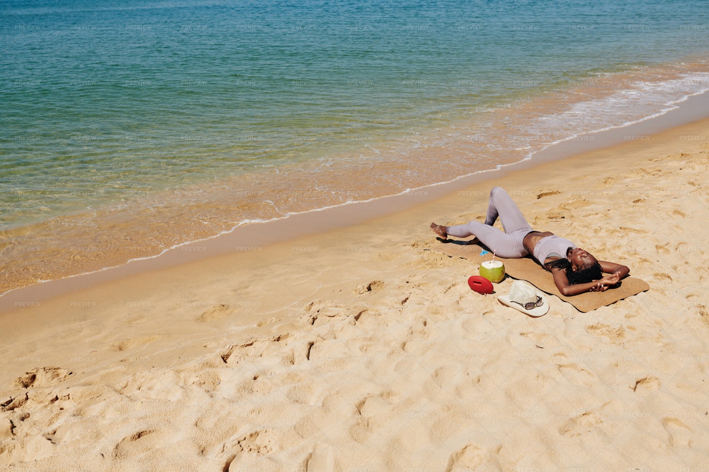 Woman Relaxing On Beach: Stock Photos