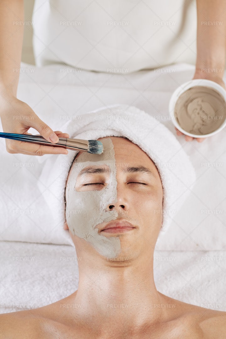 Beautician Applying Clay Mask: Stock Photos