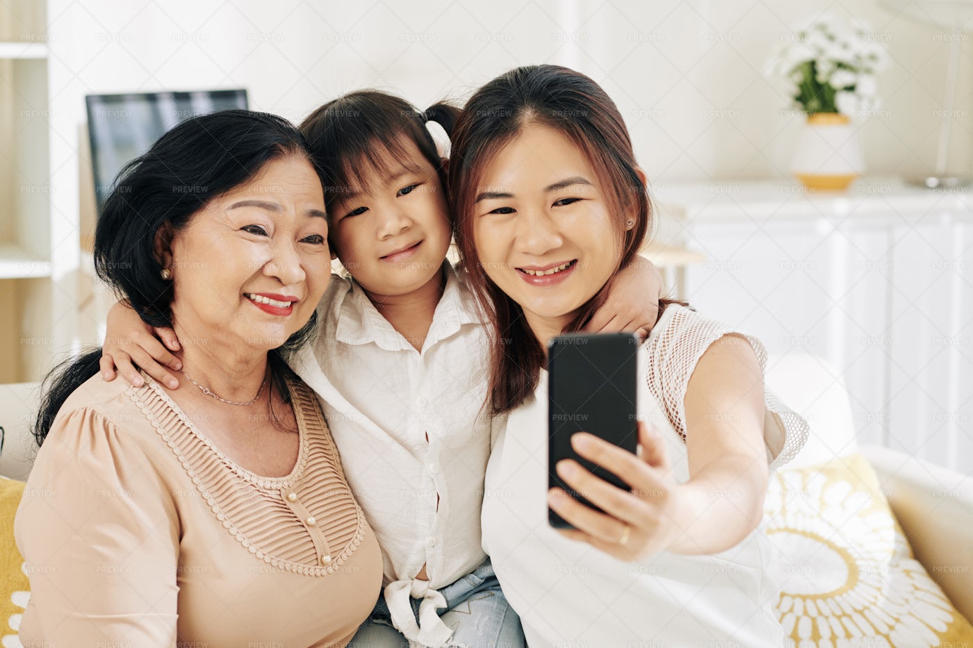 Hugging Family Taking Selfie: Stock Photos