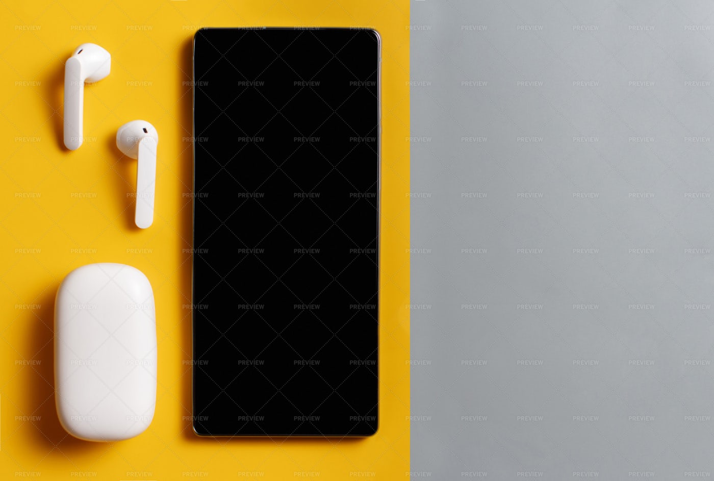Wireless Earphones And Phone: Stock Photos