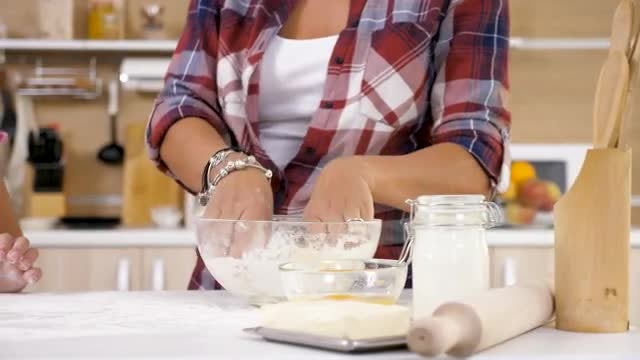 Mom Showing Daughter How To Knead Dough: Stock Video
