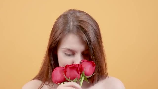 Girl Smelling Bouquet Of Roses: Stock Video