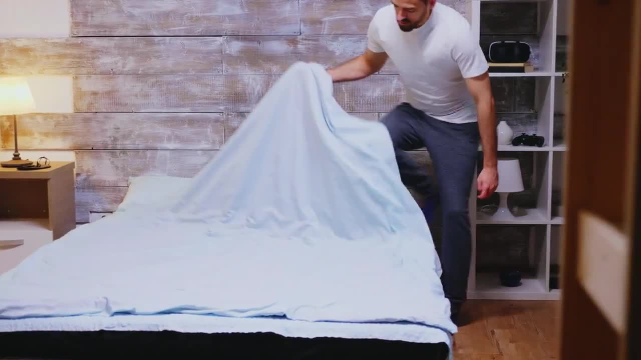 Man Gets Into Bed Stock Video Motion Array