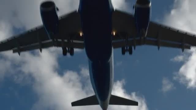 Below Landing Aircraft: Stock Video