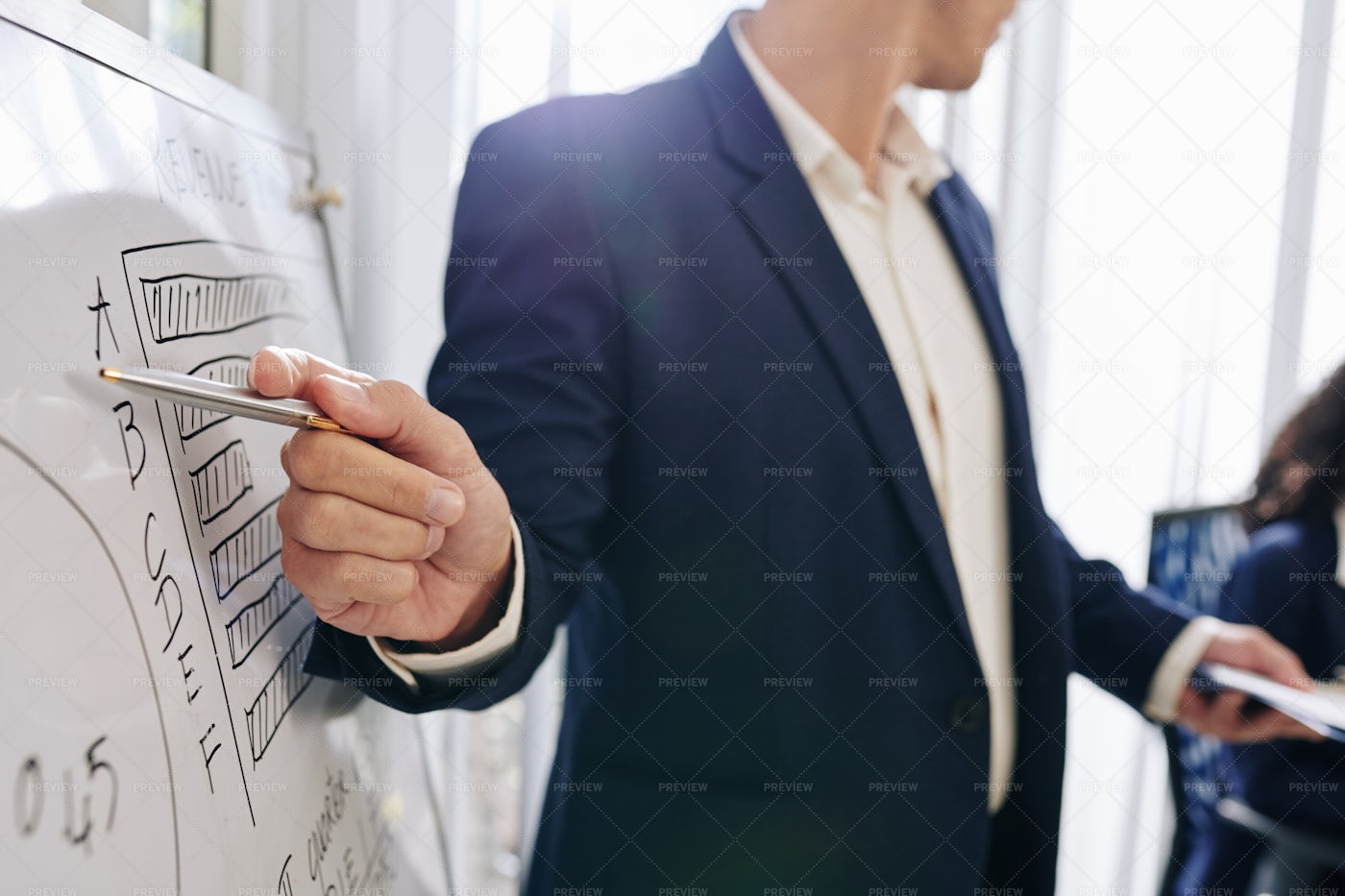 Entrepreneur Pointing On Diagram: Stock Photos