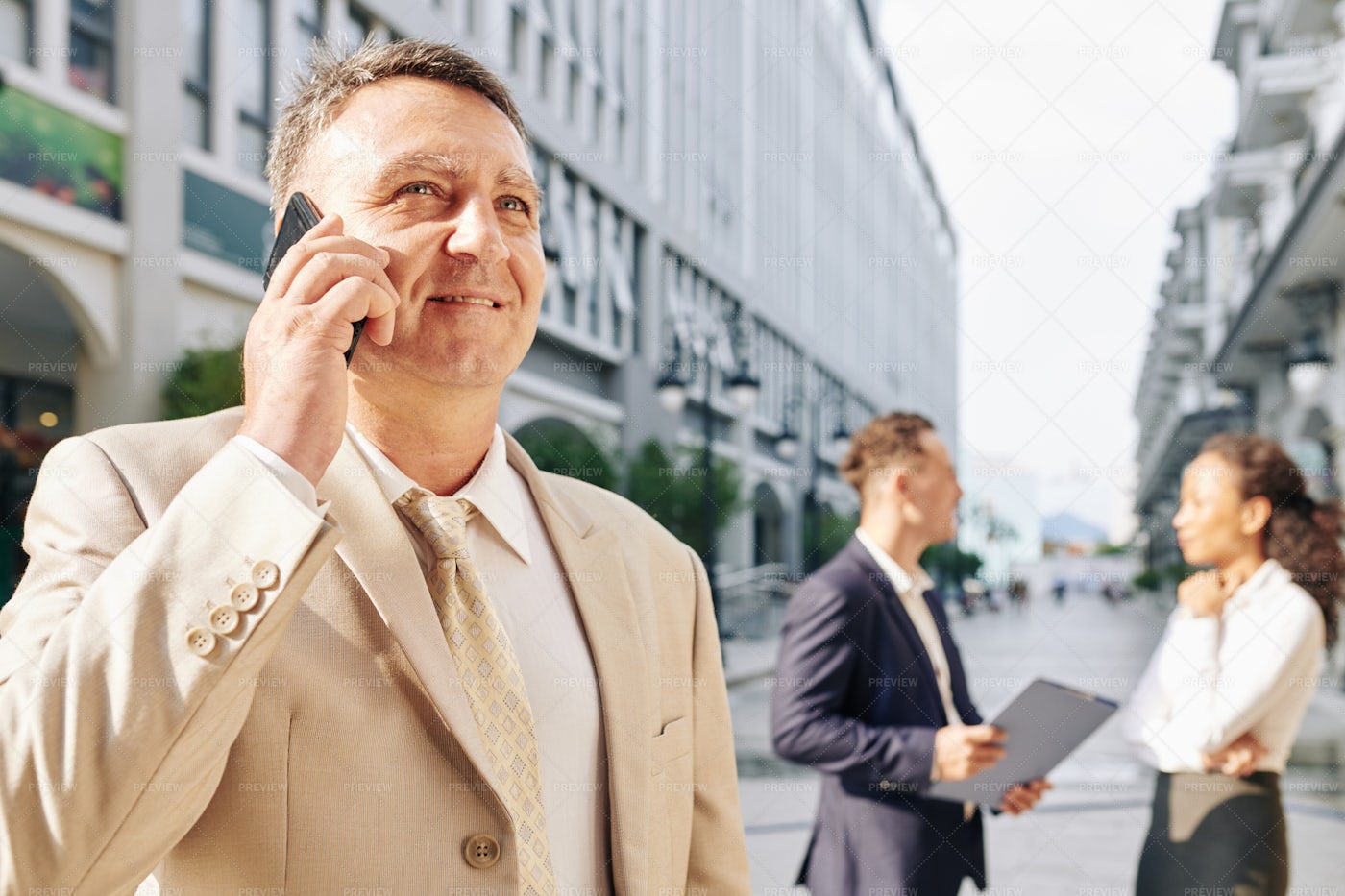 Mature Entrepreneur Talking On Phone: Stock Photos