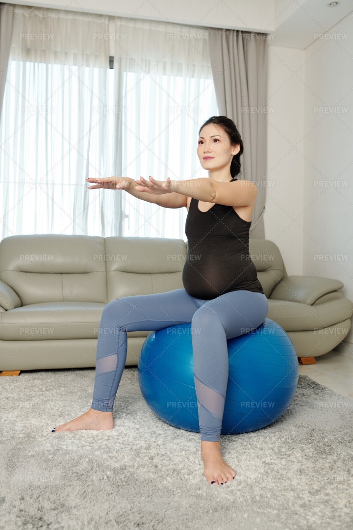 Pregnant Woman Doing Execises: Stock Photos