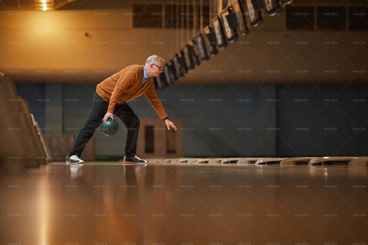 Elderly Man Playing Bowling: Stock Photos