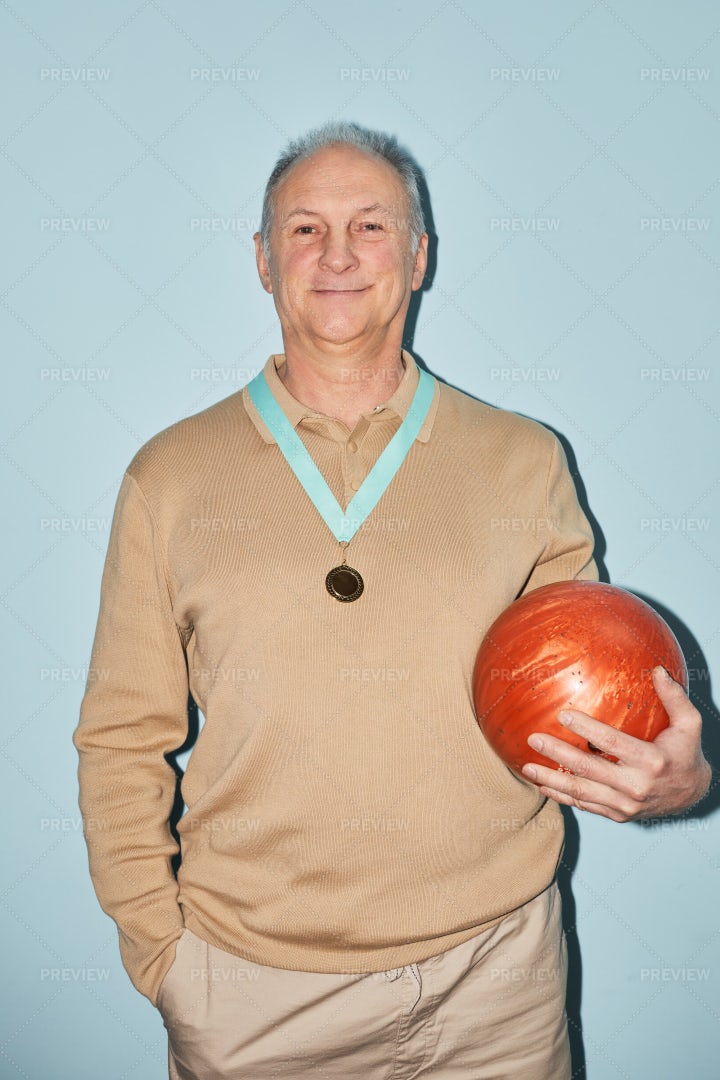 Older Bowling Player With Medal: Stock Photos