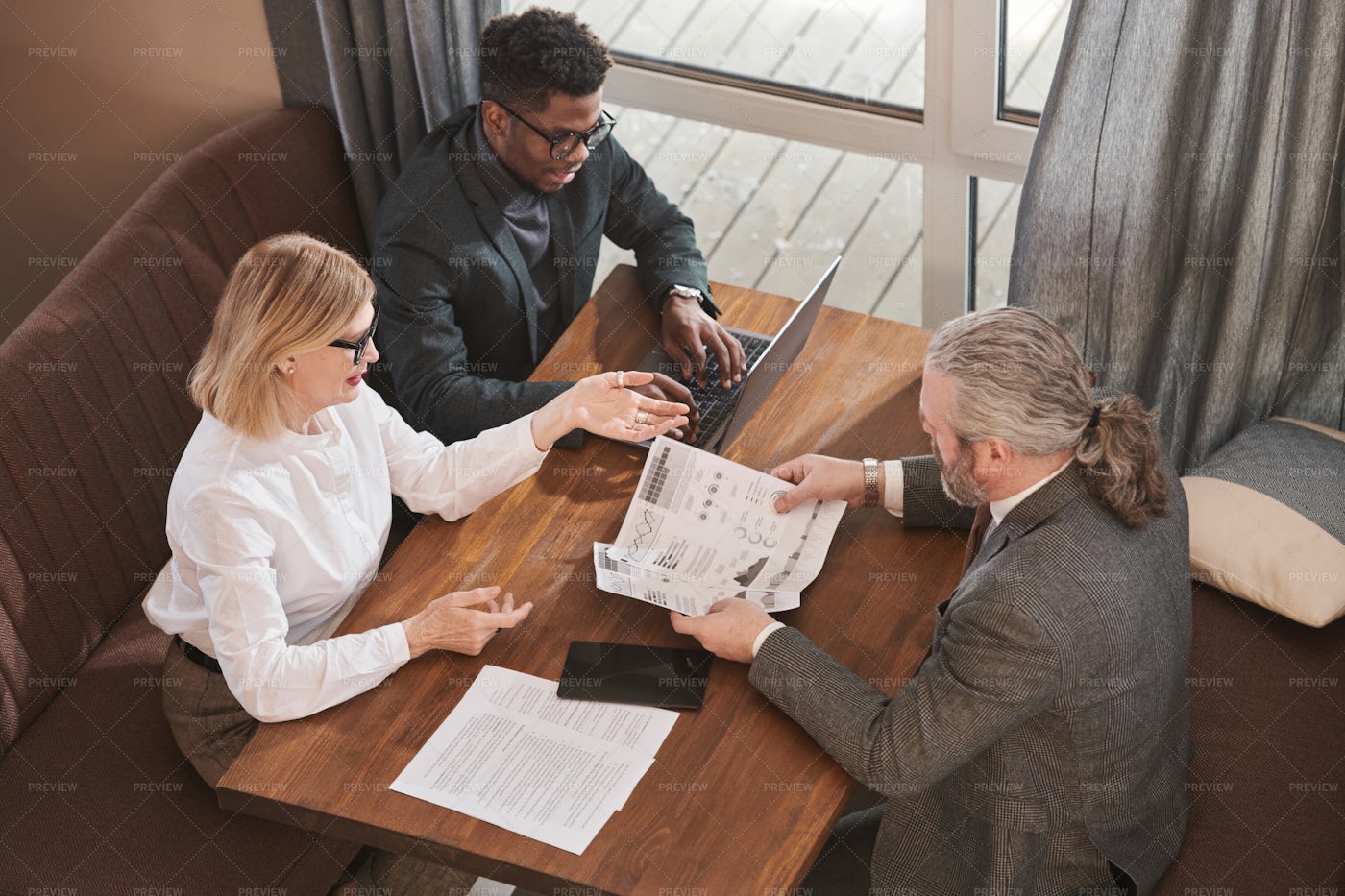 Business People Meeting In Cafe: Stock Photos