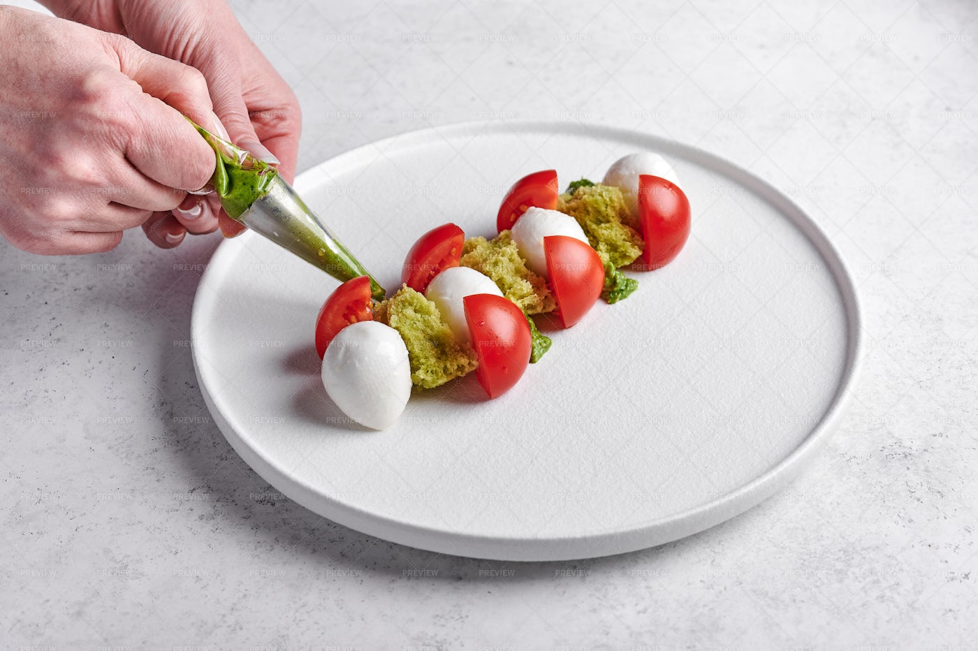 Woman's Hands Squeeze Out Pesto: Stock Photos