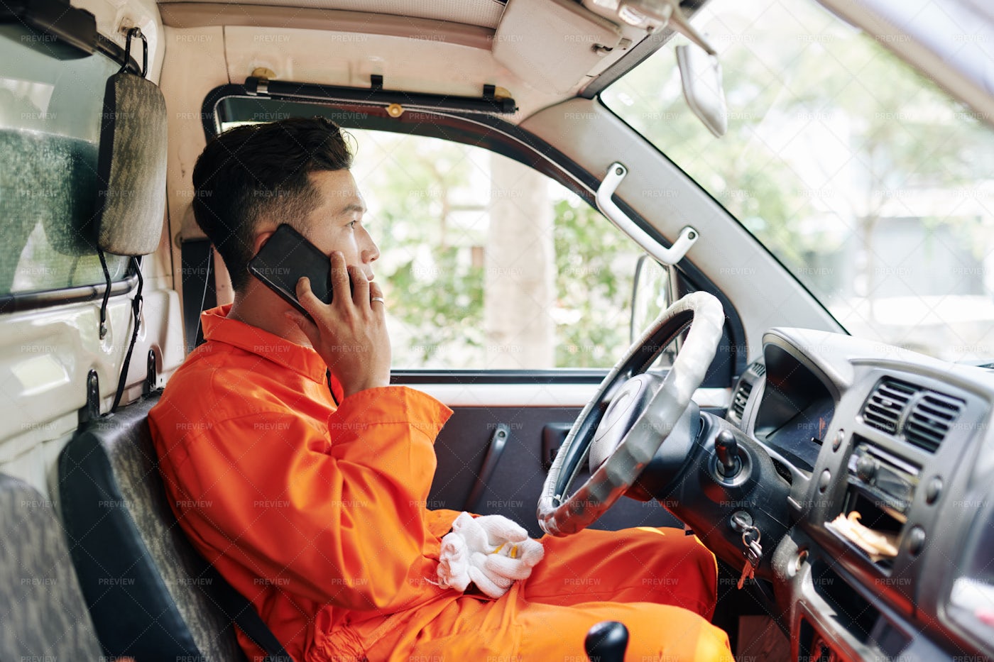 Delivery Driver Talking On Phone: Stock Photos