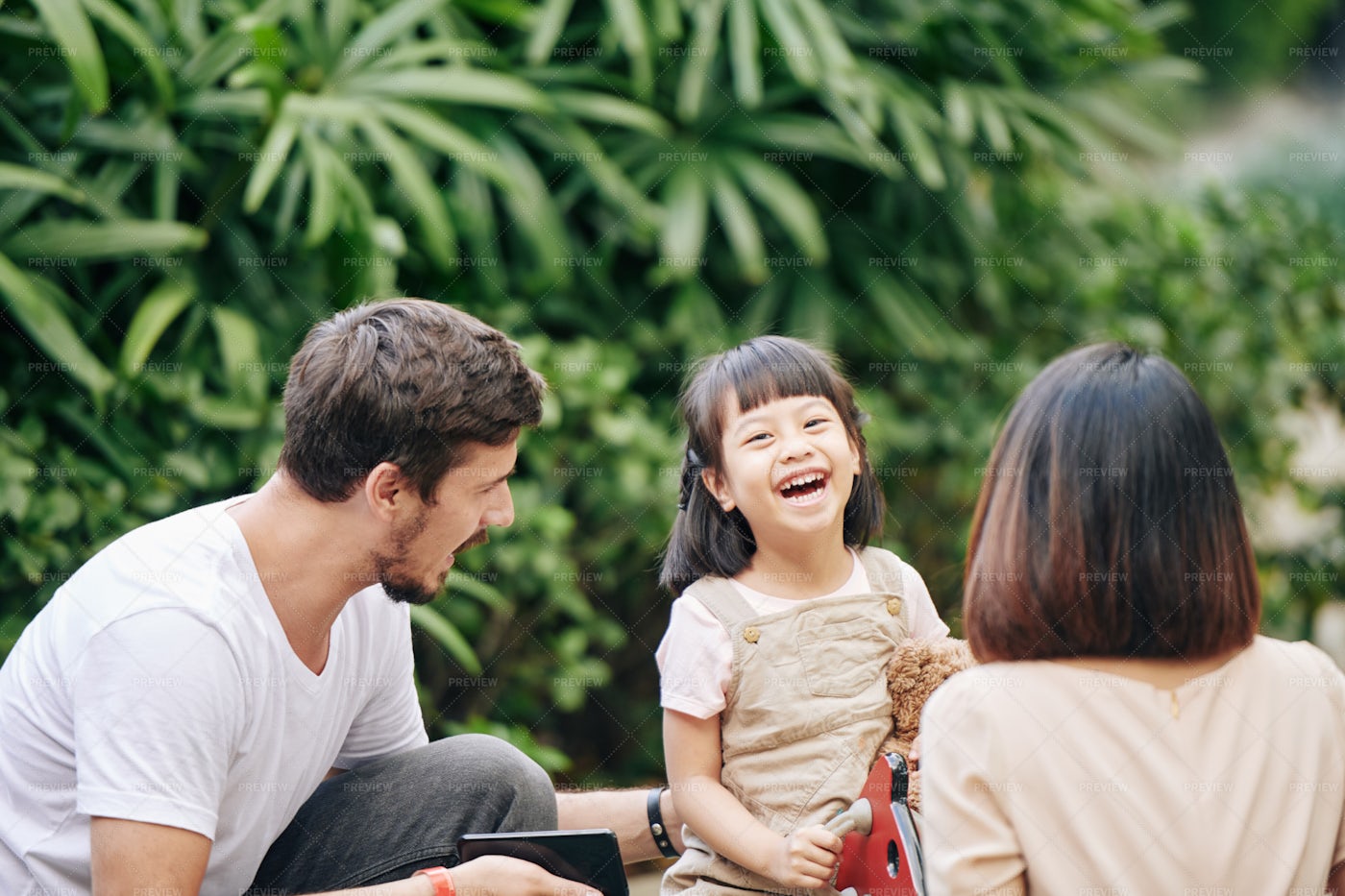 Happy Girl With Parents: Stock Photos