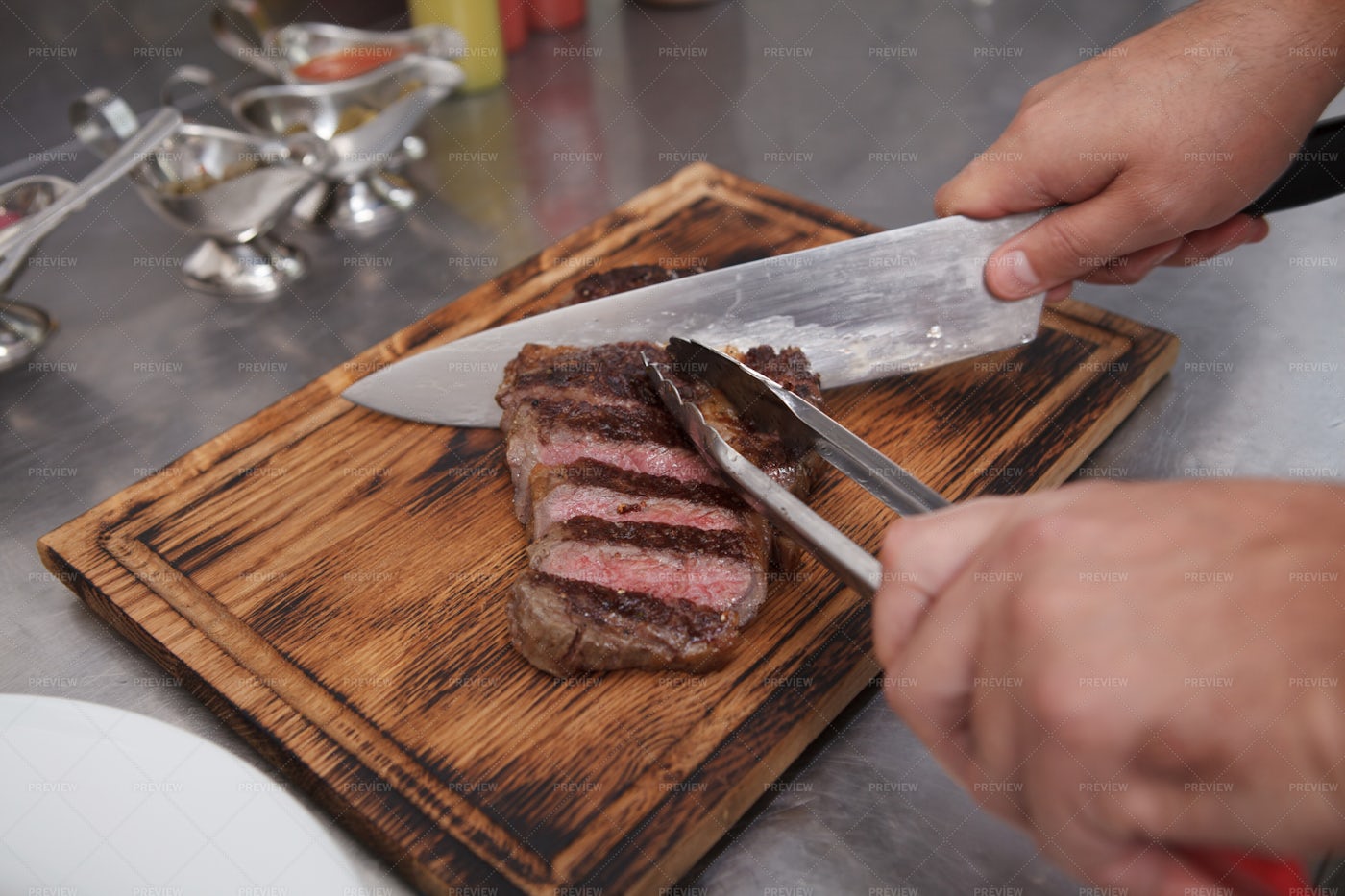 Chef Slicing Beef: Stock Photos