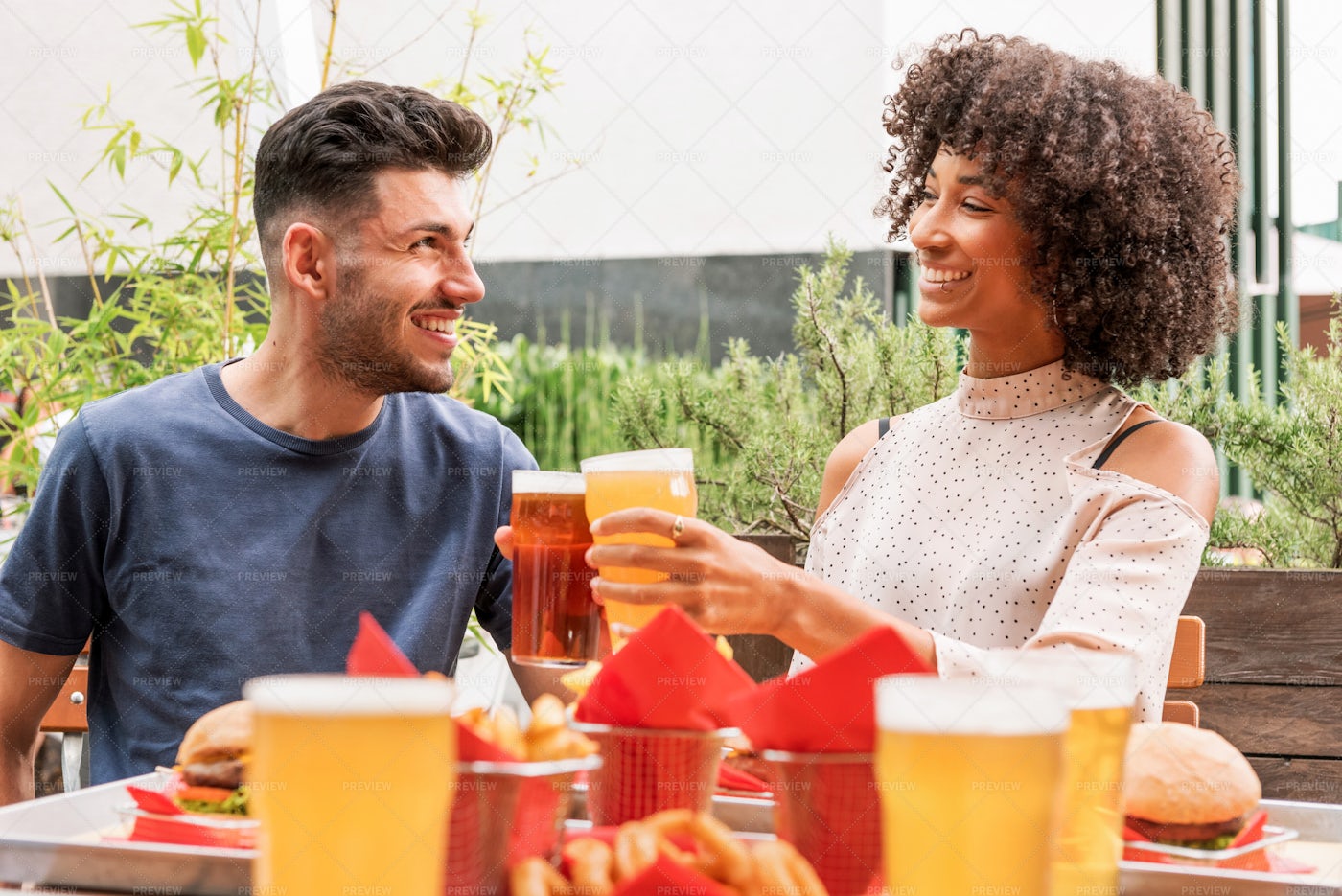 Couple Celebrating With Beer: Stock Photos
