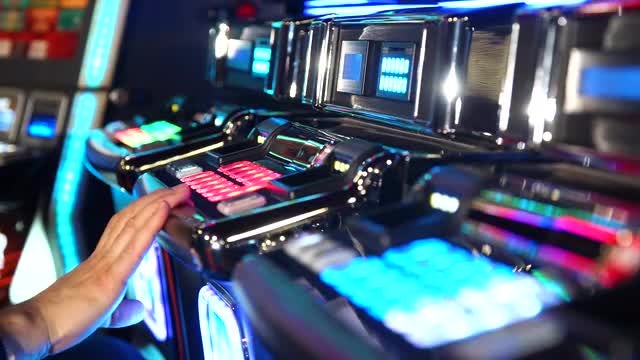 Man Playing A Slot Machine : Stock Video