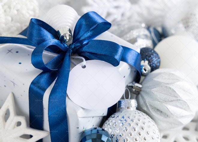 Four Presents Wrapped In White Gift Wrap With Blue Bows Stock Photo -  Download Image Now - iStock