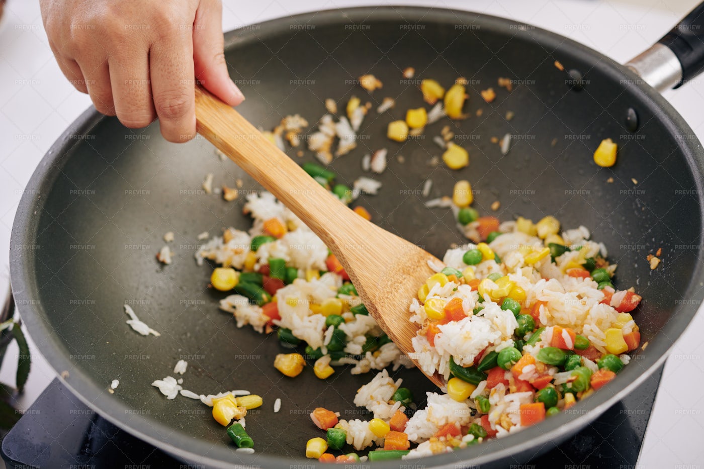 Woman Frying Rice With Vegetables: Stock Photos