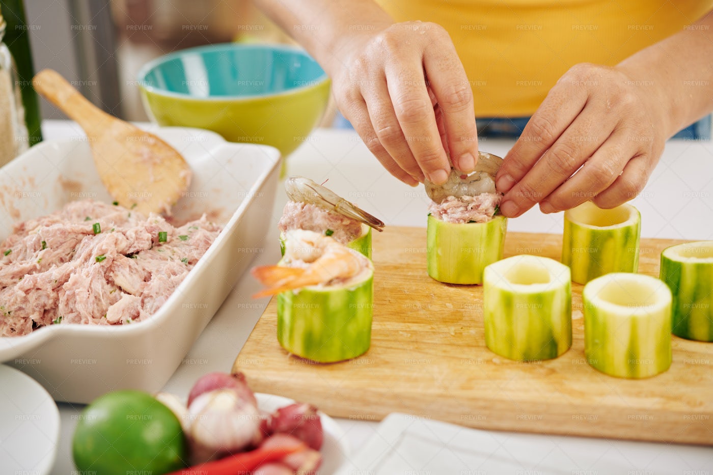 Woman Stuffing Zuccini Rings: Stock Photos
