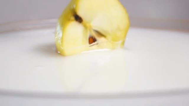Pieces Of Apple In Milk: Stock Video