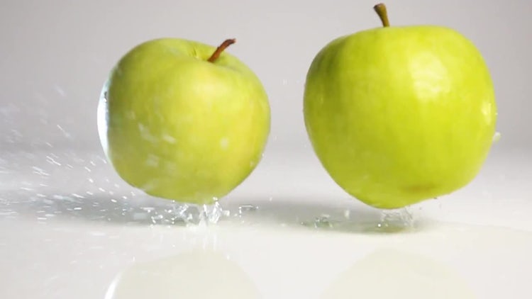 Apples Falling On Wet Surface - Stock Video | Motion Array
