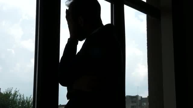 Silhouette Of A Troubled Man : Stock Video