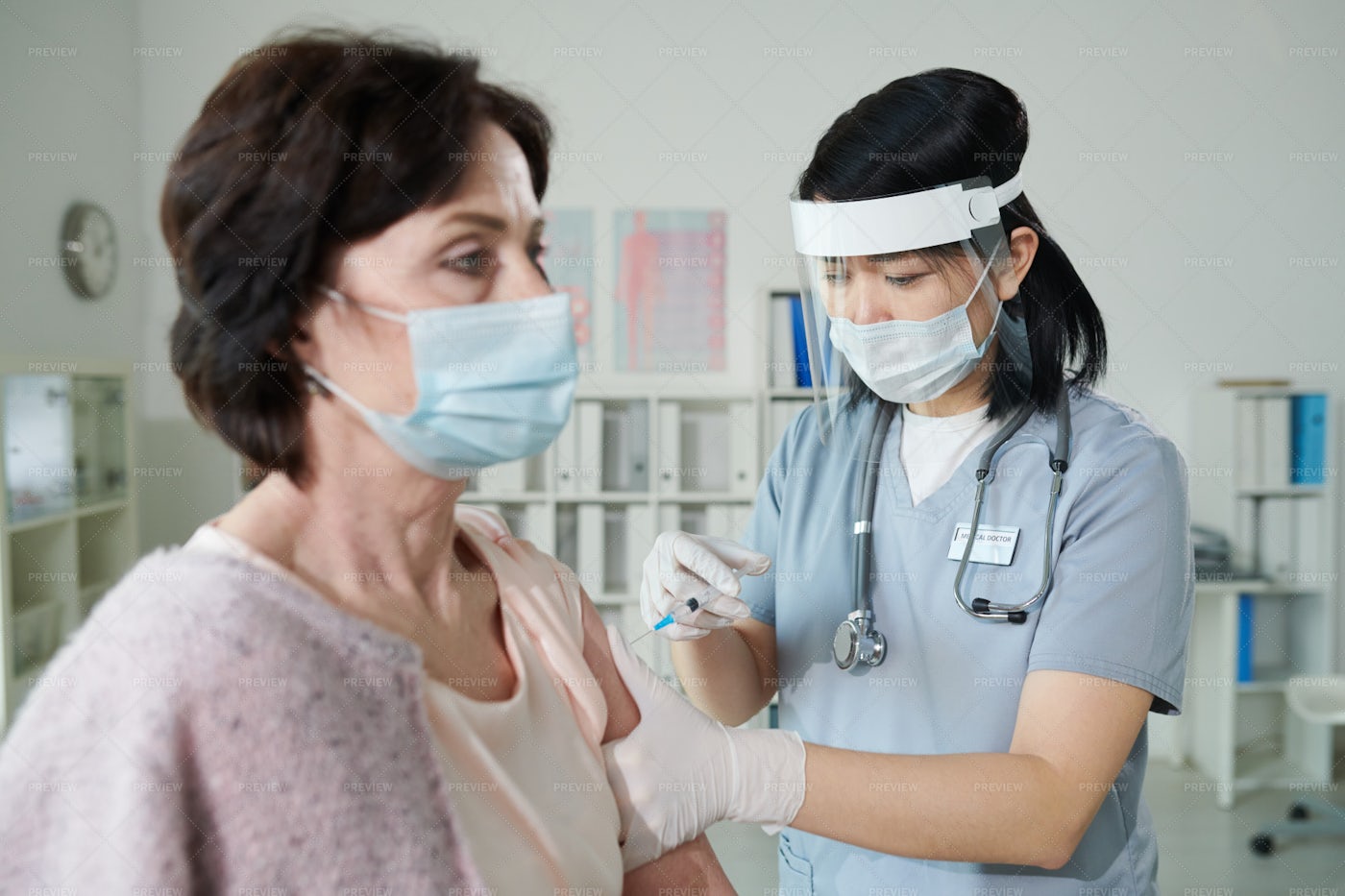 Woman Being Vaccinated: Stock Photos