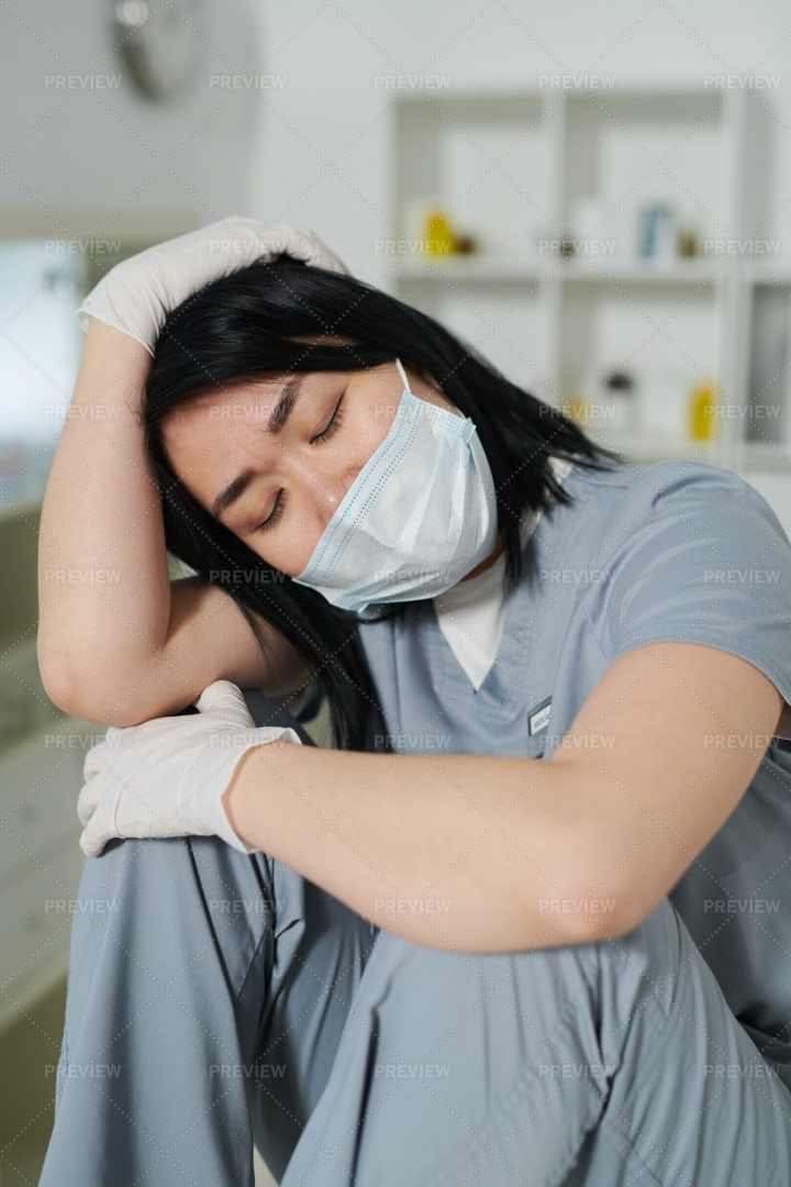 Tired Nurse In Face Mask: Stock Photos