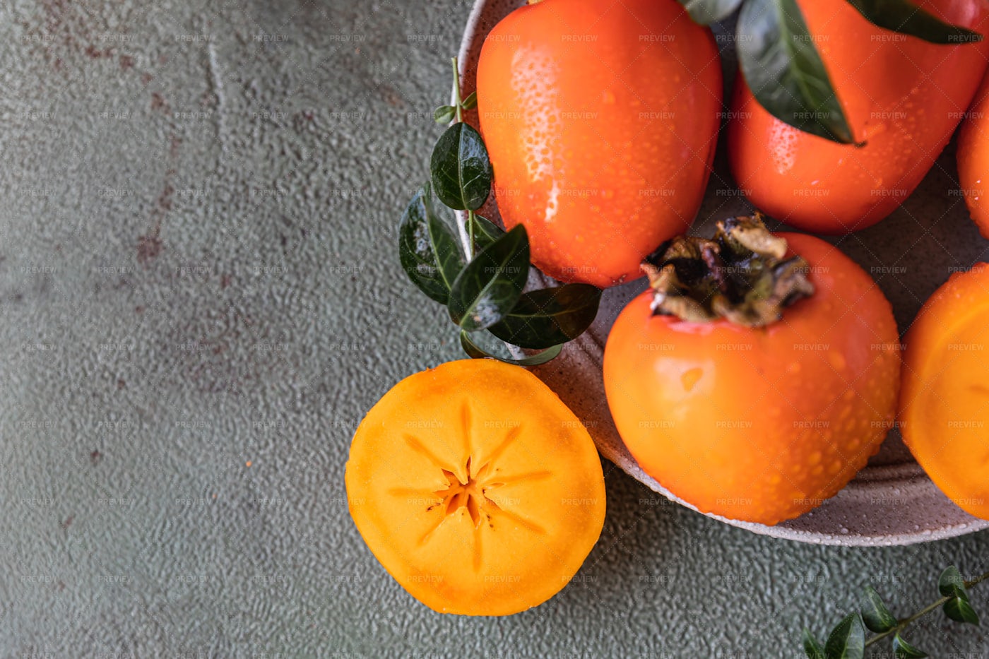 Whole And Cut Persimmon Fruit: Stock Photos