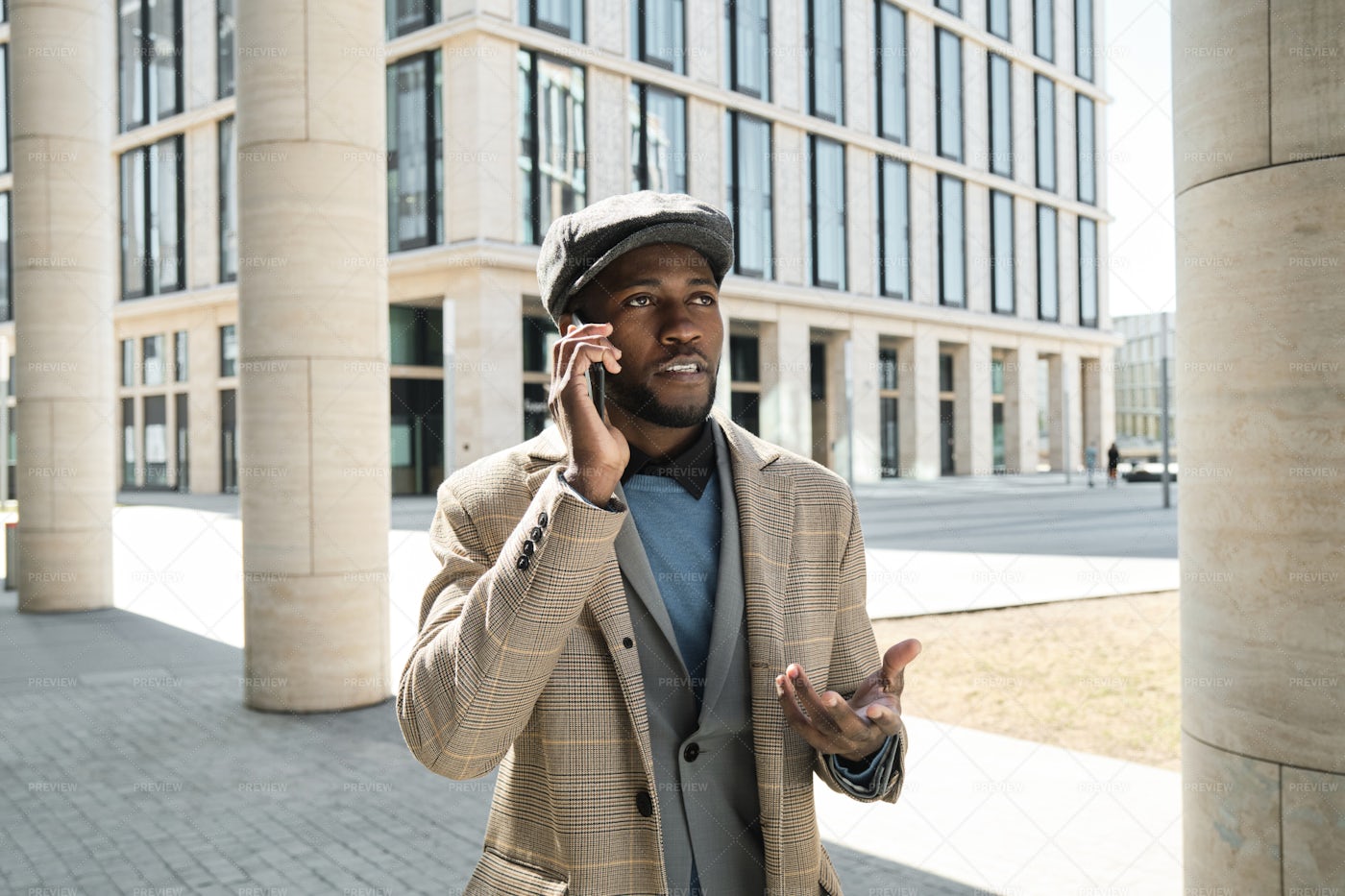 Young Man Using Phone In The City: Stock Photos