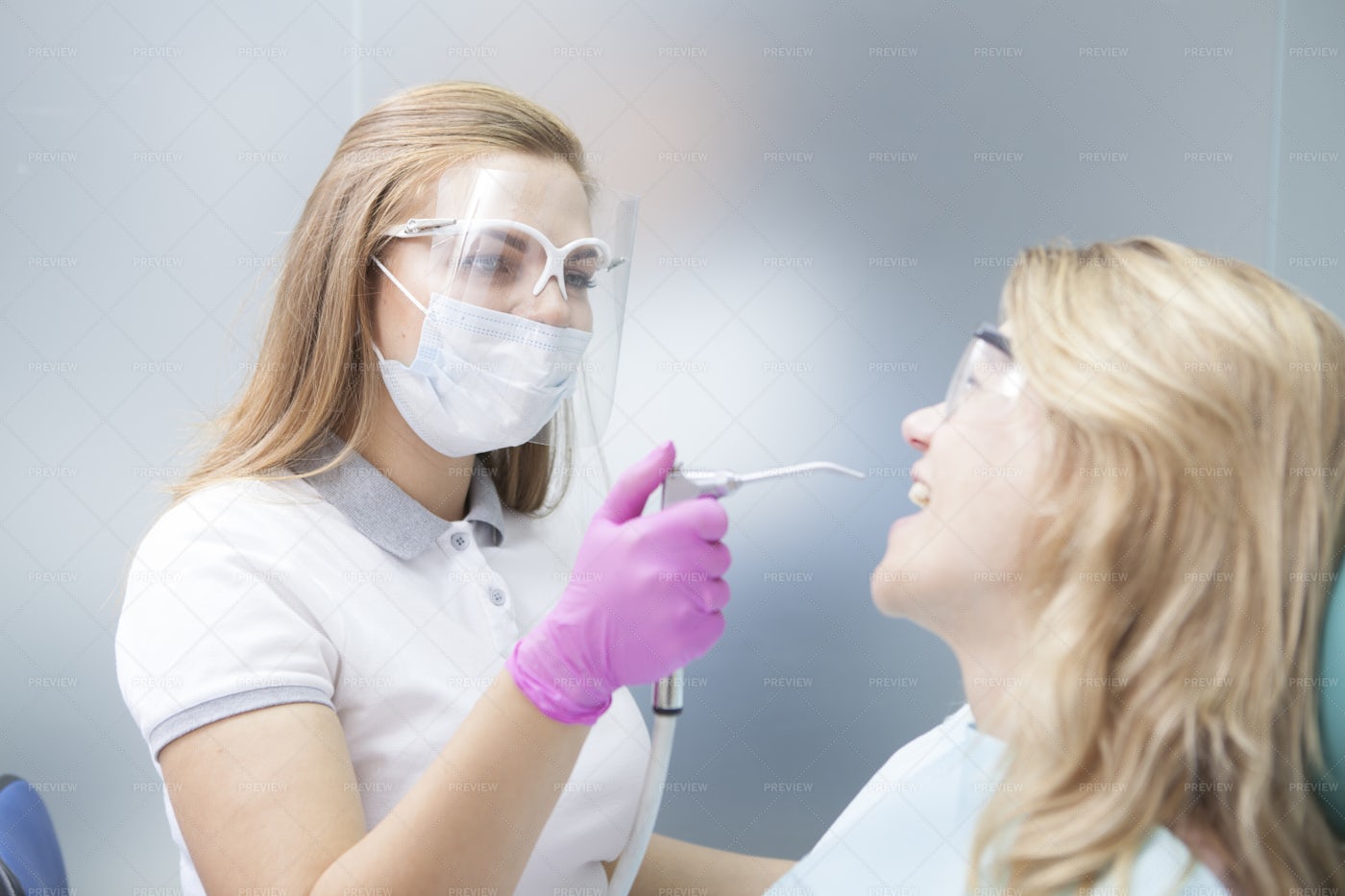 Dentist Working During Pandemic: Stock Photos