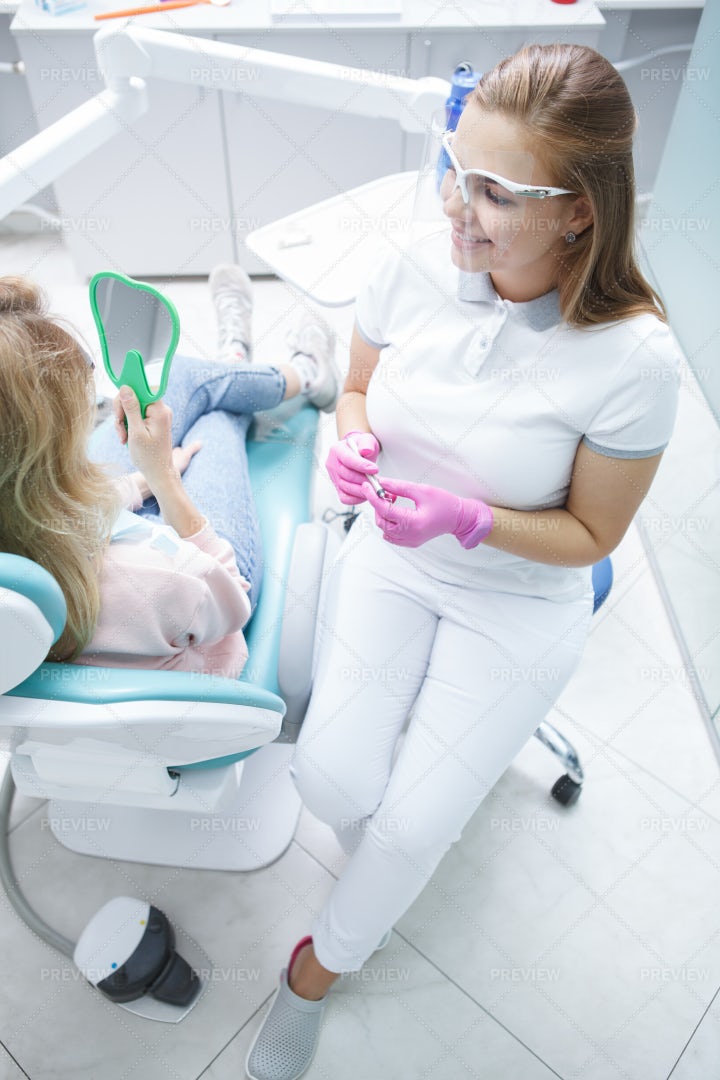 Dentist Working At Clinic: Stock Photos