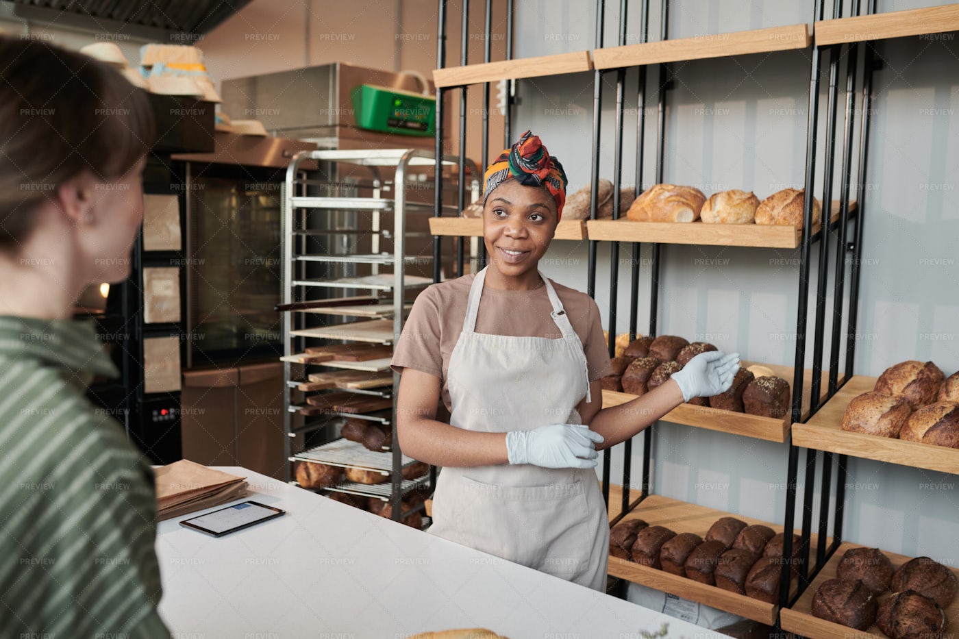 Woman Selling A Bread In The Store: Stock Photos