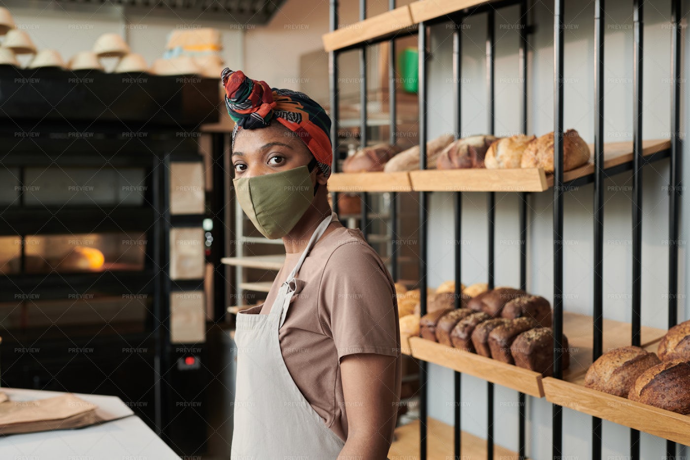 Saleswoman In Mask In Bakery Shop: Stock Photos