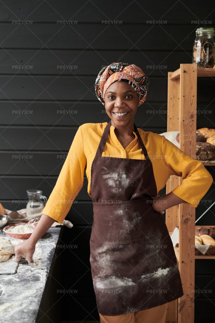 Baker In Apron In The Kitchen: Stock Photos
