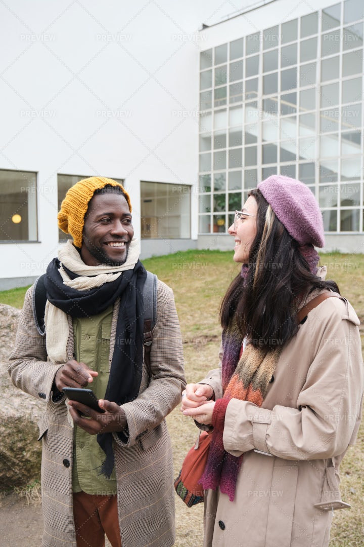 Two Friends Walking Outdoors: Stock Photos