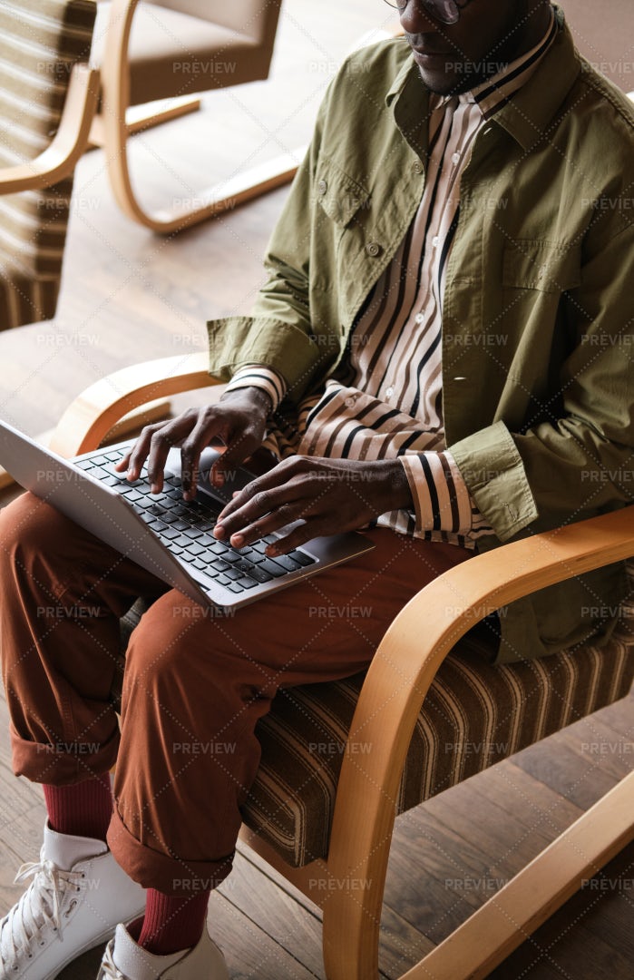 Young Man Typing On Laptop: Stock Photos