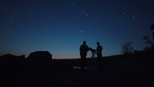 Men Use A Telescope: Stock Video