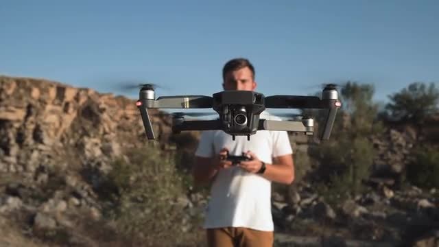 Man Controlling A Drone: Stock Video