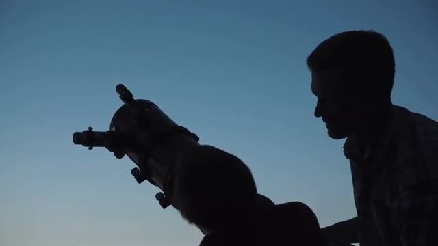 Father And Son Use Telescope: Stock Video