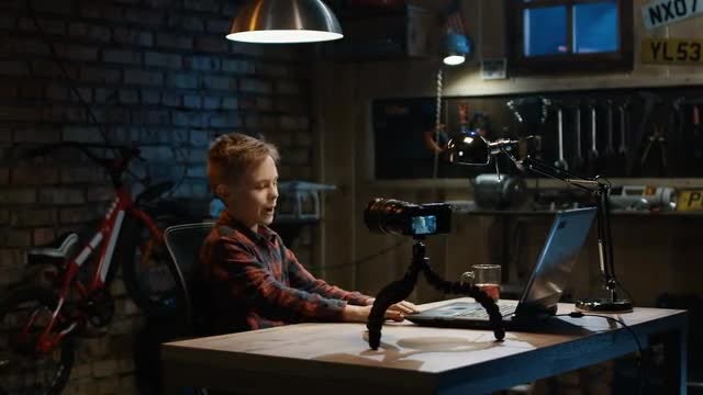 Boy Talking On Camera: Stock Video