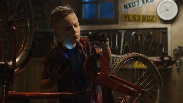 Teenage Boy Repairs Bicycle: Stock Video