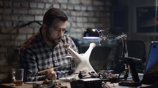 Man Fixing A Drone: Stock Video